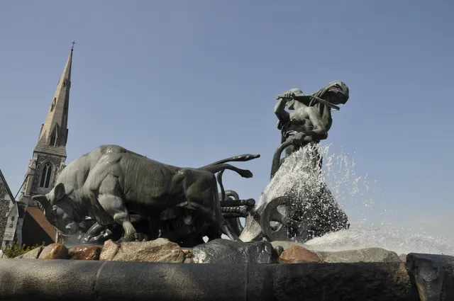 Two large sculptures displayed in an open square