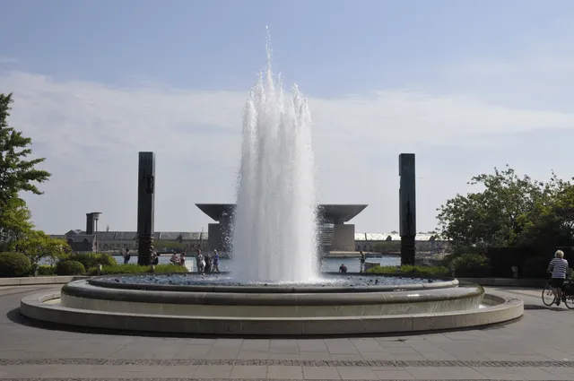 A fountain in a sunny public garden